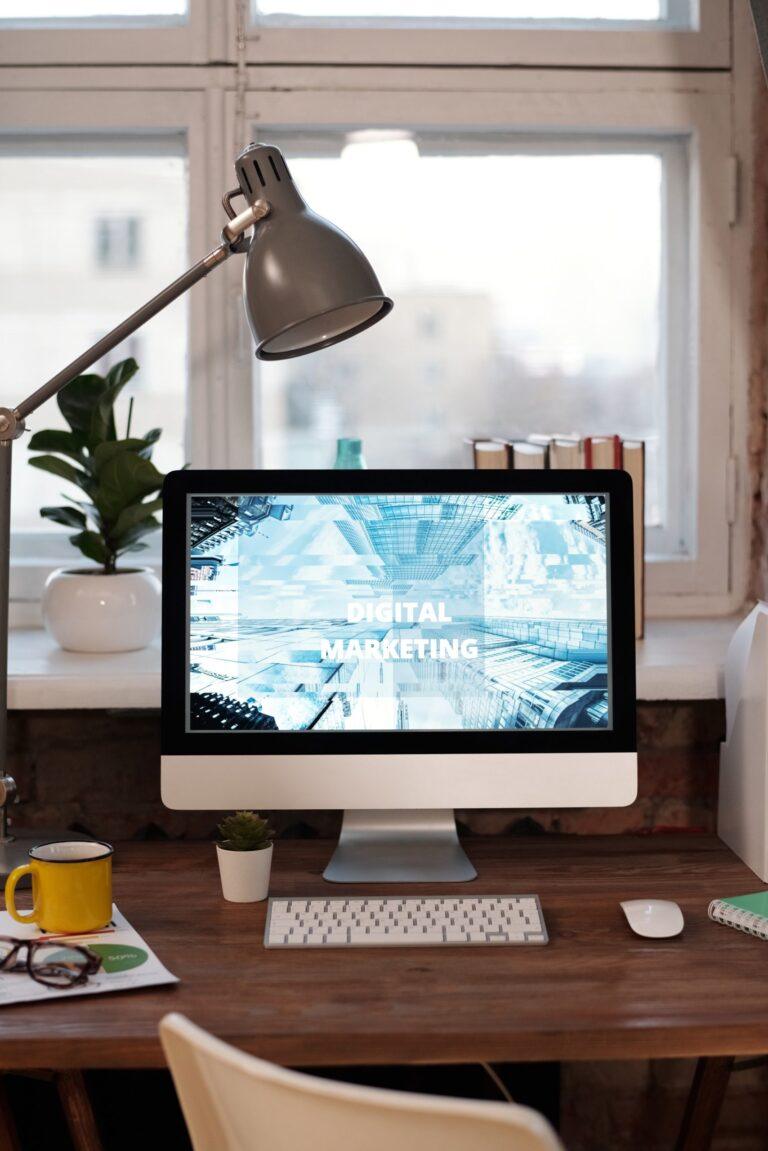 a desktop computer sitting on top of a wooden desk