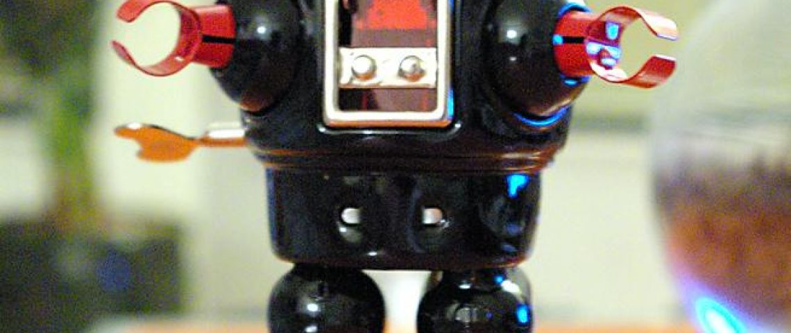 a toy robot sitting on top of a table